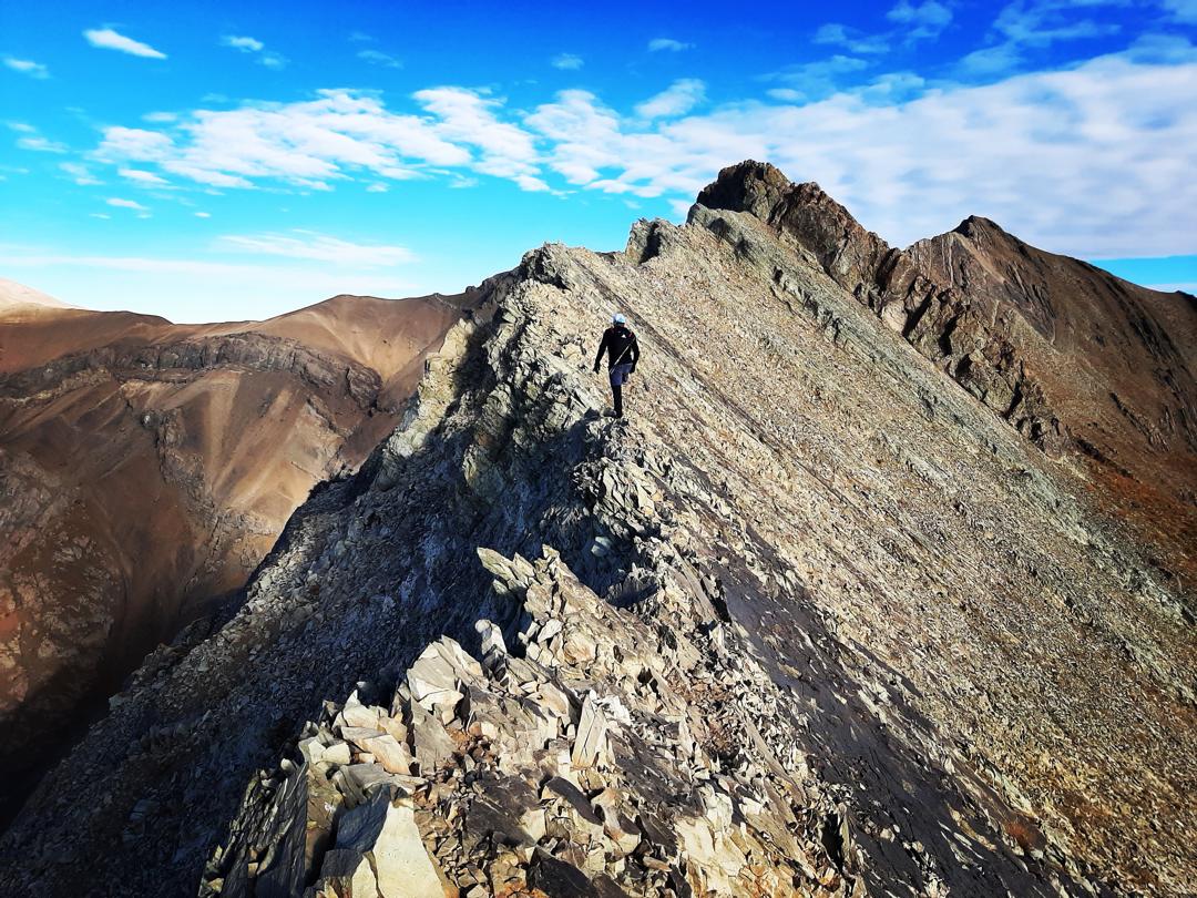 Climbing along a mountain ridge